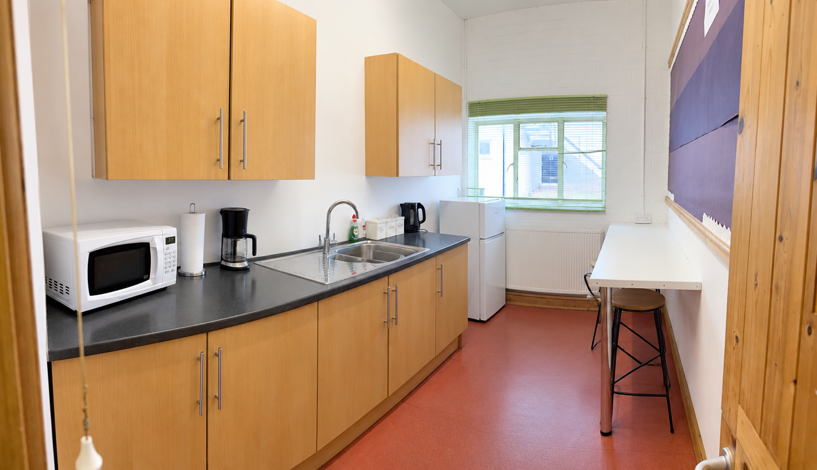The LHTS kitchen with a sink, microwave, fridge and refreshment facilities